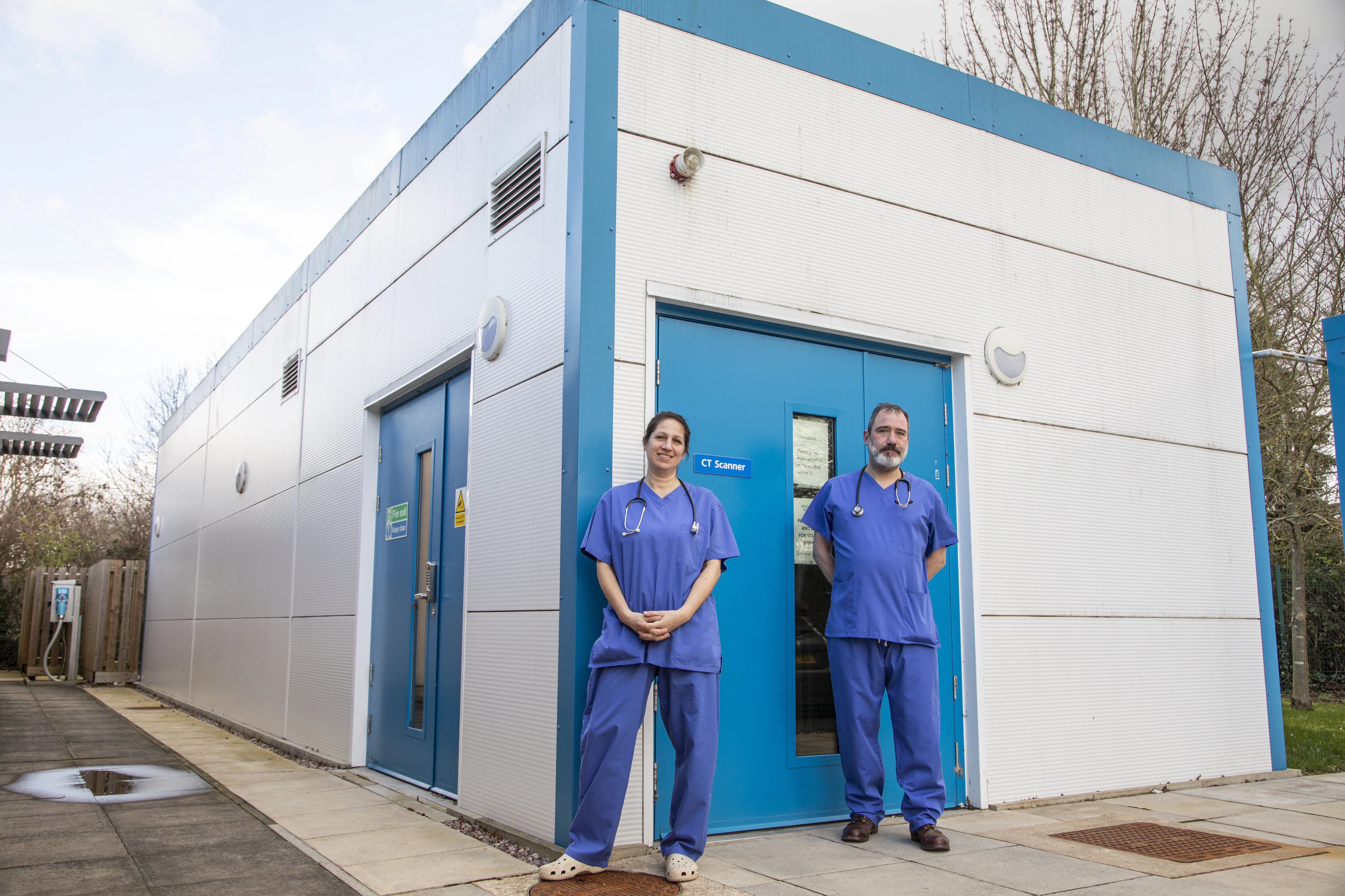 Medical Professional in front of a clinic